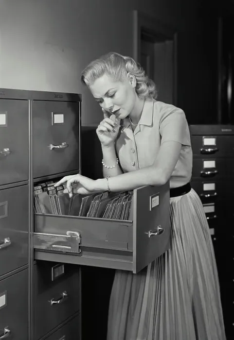 Framed Print : Vintage Photograph. Young woman wearing dress going through folders in drawer of filing cabinet, Frame 4 Framed Print : Vintage Photograph. Young woman wearing dress going through folders in drawer of filing cabinet, Frame 4