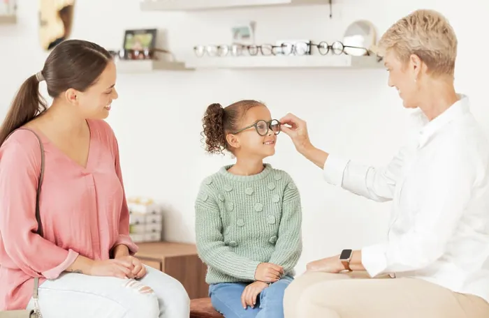 Framed Print : Vision glasses, mother and child with optometrist for eye care consultation