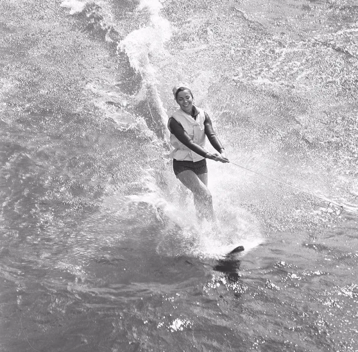 Framed Print : Waterskiing in the 1960s. A young woman is waterskiing. Sweden July 1964 Framed Print : Waterskiing in the 1960s. A young woman is waterskiing. Sweden July 1964