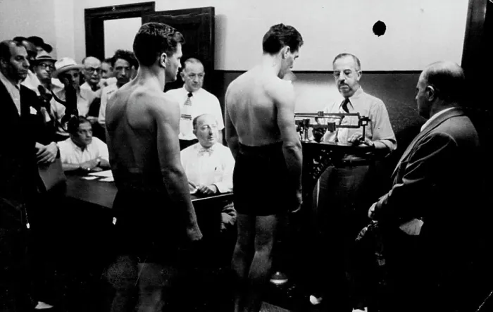 Framed Print : Weighing-time at the N.Y. State Athletic Commission is 12 noon. An official does the job. April 01, 1949