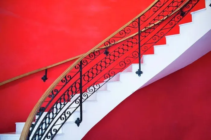 Framed Print : White sweeping staircase set against a red wall in Havana Framed Print : White sweeping staircase set against a red wall in Havana
