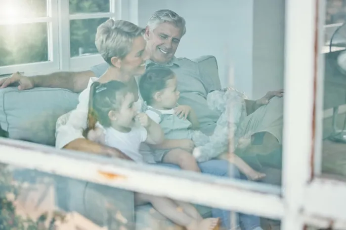 Framed Print : Window, sofa and grandparents and children watching tv Framed Print : Window, sofa and grandparents and children watching tv
