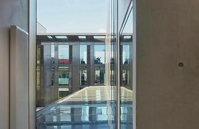 Framed Print : Window view through with glass canopy towards building link Framed Print : Window view through with glass canopy towards building link
