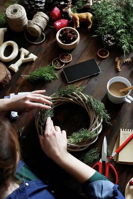 Framed Print : Woman decorating Advent wreath on work table, partial view Framed Print : Woman decorating Advent wreath on work table, partial view