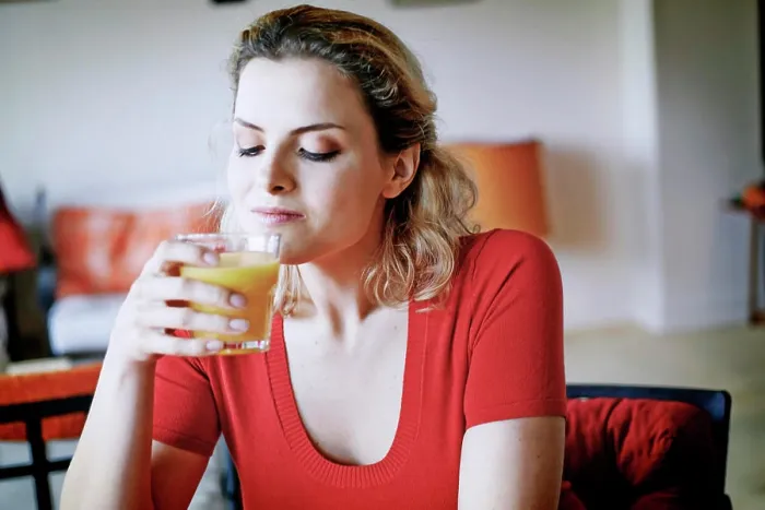 Framed Print : Woman drinking orange juice Framed Print : Woman drinking orange juice