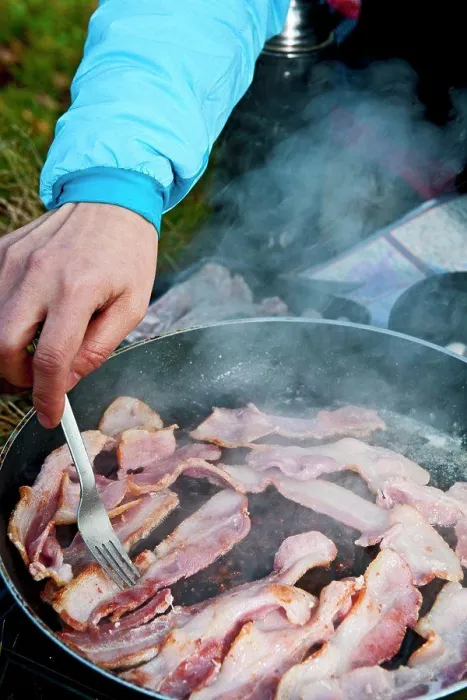 Framed Print : woman frying bacon during picnic in south Wales Framed Print : woman frying bacon during picnic in south Wales