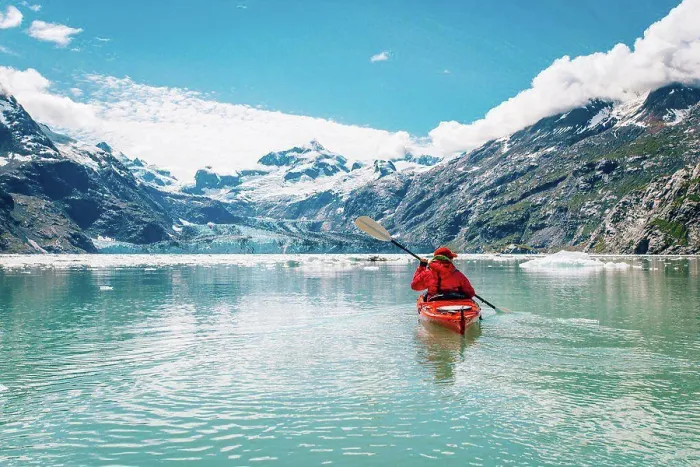 Framed Print : Woman kayaking in Glacier Bay National Park with glacier in background Framed Print : Woman kayaking in Glacier Bay National Park with glacier in background