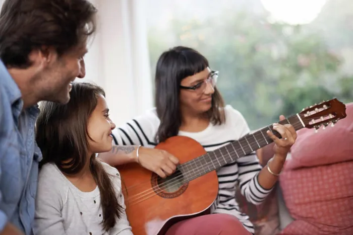 Framed Print : Woman, music and playing guitar for family at home Framed Print : Woman, music and playing guitar for family at home