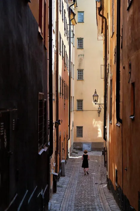 Framed Print : Woman in the narrow alleys of Gamla Stan in Stockholm Framed Print : Woman in the narrow alleys of Gamla Stan in Stockholm