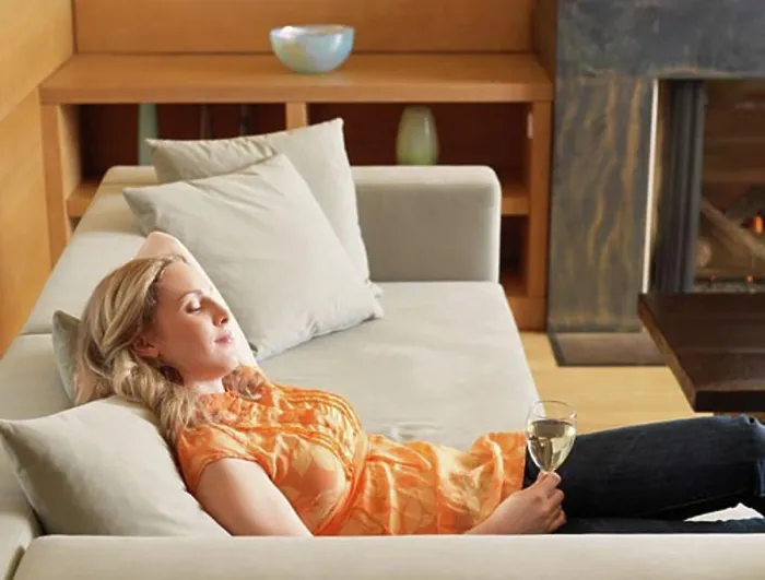 Framed Print : Woman Relaxing on Sofa Framed Print : Woman Relaxing on Sofa