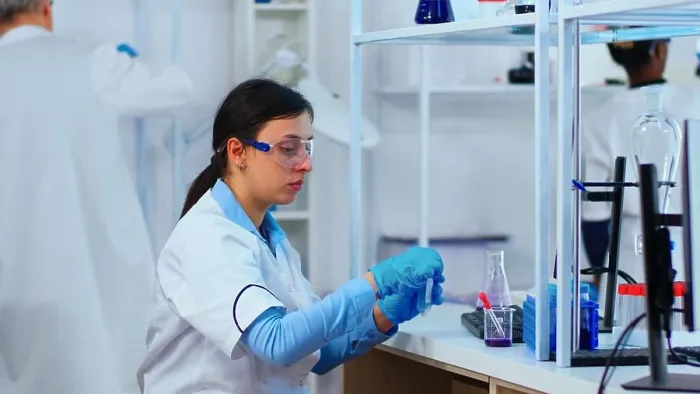 Framed Print : Woman scientist filling liquid test tube with pipette Framed Print : Woman scientist filling liquid test tube with pipette