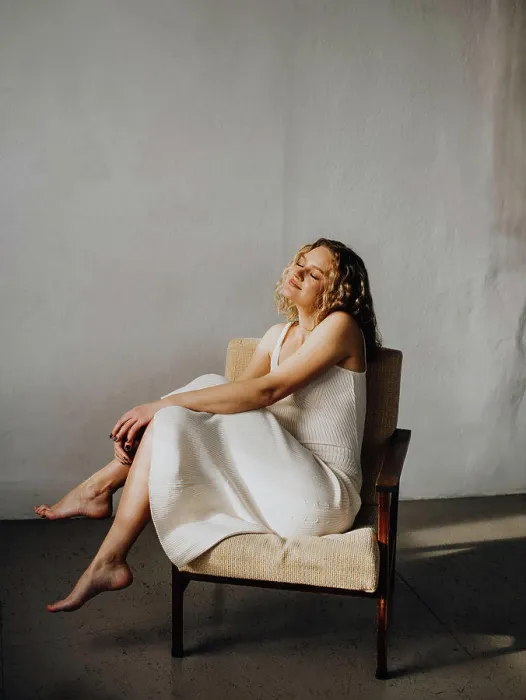 Framed Print : woman in white dress in armchair Framed Print : woman in white dress in armchair