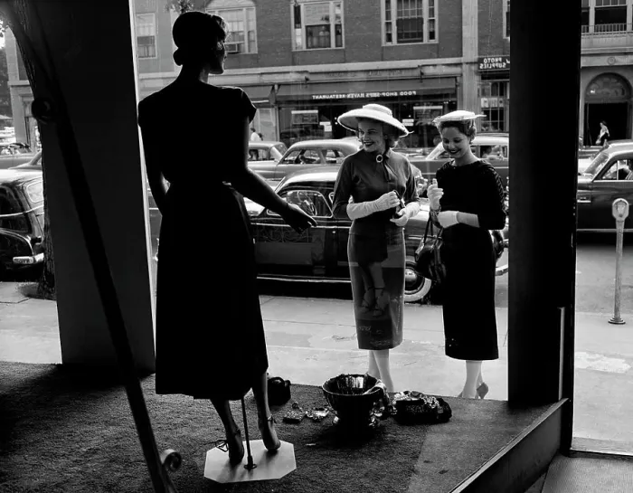 Framed Print : Women looking at window display Framed Print : Women looking at window display