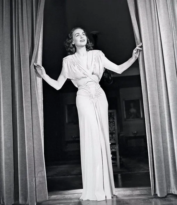 Framed Print : Women's fashion in the 1940s. A young woman in a typical 1940s outfit Framed Print : Women's fashion in the 1940s. A young woman in a typical 1940s outfit