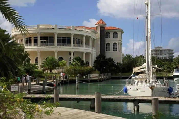 Framed Print : Yacht moored in a harbor in front of a casino, Grand Princess Casino, Jolly Harbor, Antigua Framed Print : Yacht moored in a harbor in front of a casino, Grand Princess Casino, Jolly Harbor, Antigua