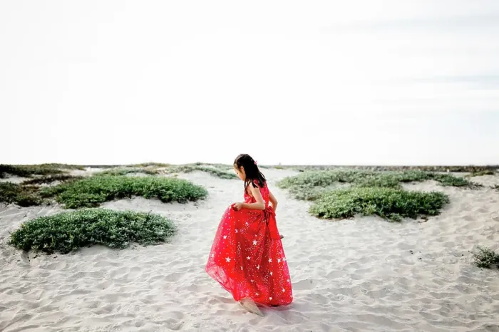 Framed Print : Six Year Old Asian Girl in Red Dress Walking on Beach Framed Print : Six Year Old Asian Girl in Red Dress Walking on Beach