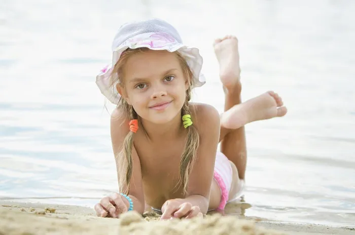 Framed Print : Six year old girl lying on the sand on the beach Six year old girl Europeans in panama lying on his stomach on the sand Framed Print : Six year old girl lying on the sand on the beach Six year old girl Europeans in panama lying on his stomach on the sand