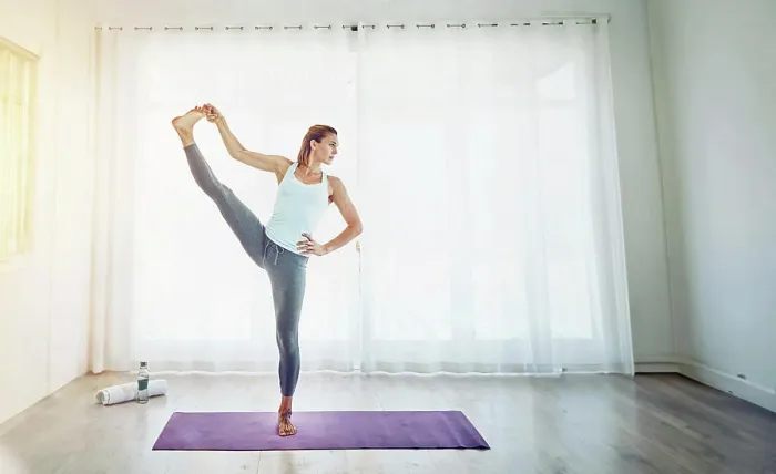 Framed Print : Yoga, woman and stretching leg in home on mat with balance
