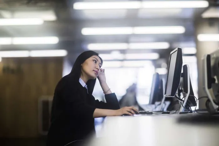Framed Print : young asia woman with paper in an office working Framed Print : young asia woman with paper in an office working