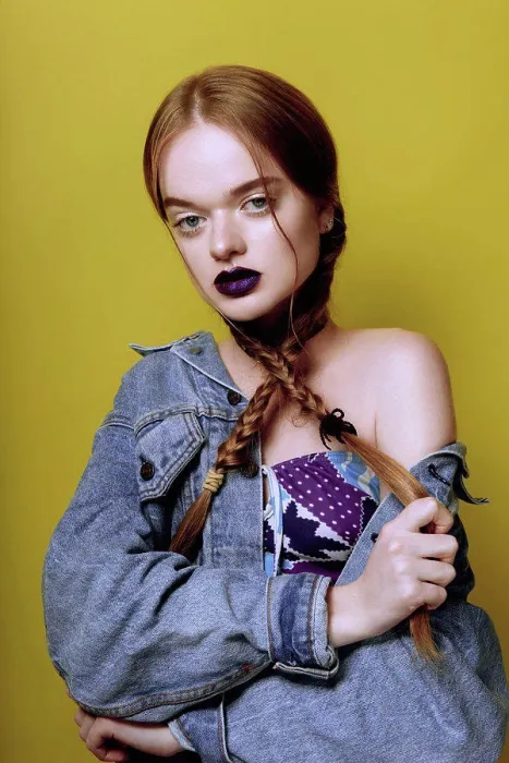 Framed Print : A young beautiful red haired girl posing in jeans jacket with purple lips on yellow background Framed Print : A young beautiful red haired girl posing in jeans jacket with purple lips on yellow background