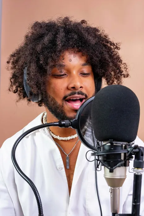 Framed Print : Young black man recording podcast or music
