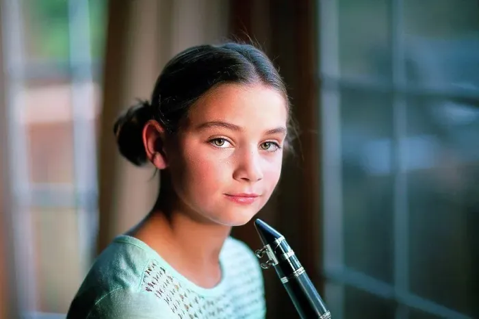 Framed Print : Young clarinettist posing with her clarinet Framed Print : Young clarinettist posing with her clarinet