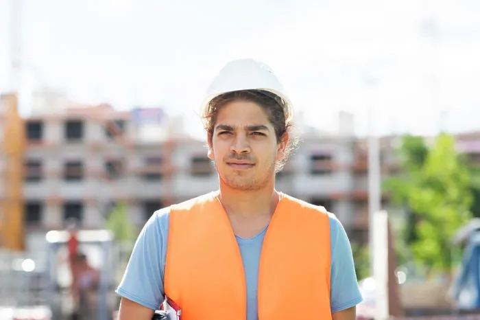 Framed Print : young construction engineer with helmet working outside Framed Print : young construction engineer with helmet working outside