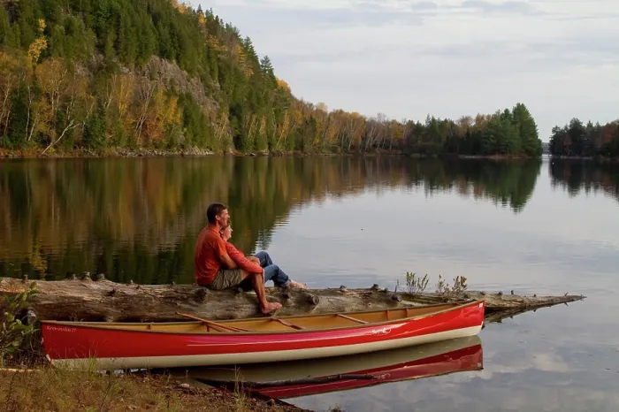 Framed Print : Young couple enjoy quite evening beside canoe on Oxtongue Lake, Muskoka, Ontario, Canada Framed Print : Young couple enjoy quite evening beside canoe on Oxtongue Lake, Muskoka, Ontario, Canada