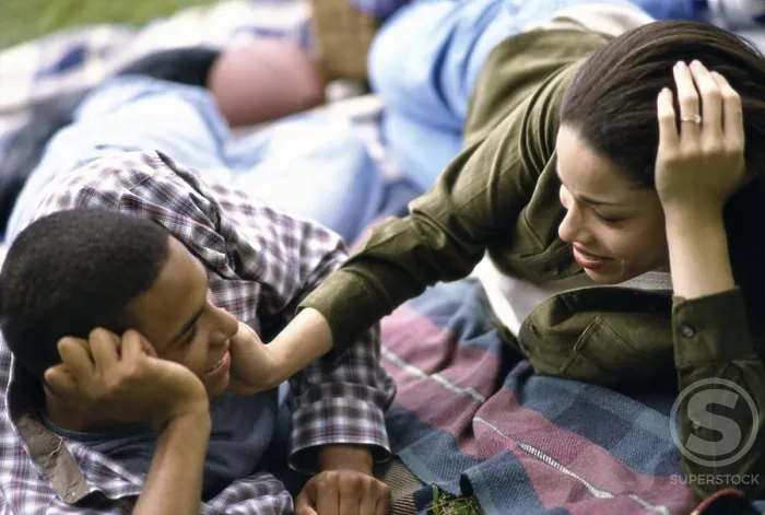 Framed Print : Young couple lying down together Framed Print : Young couple lying down together