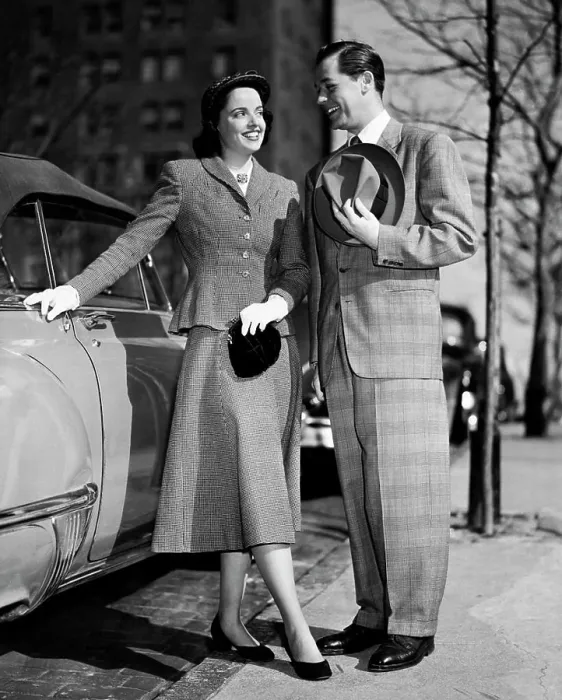 Framed Print : Young couple standing near a car Framed Print : Young couple standing near a car
