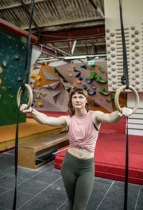 Framed Print : Young female rock climber training at gymnastics rings Framed Print : Young female rock climber training at gymnastics rings