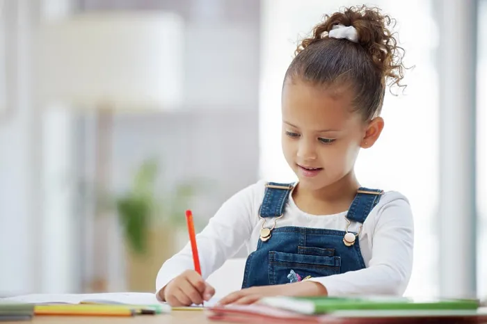 Framed Print : Young girl, writing and homework with book for learning