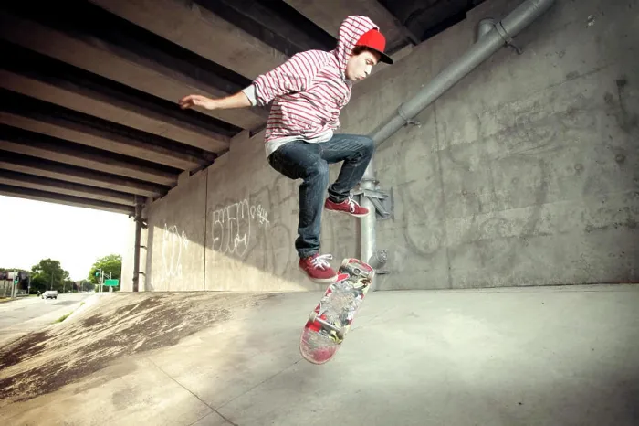 Framed Print : Young male skateboarding under overpass Framed Print : Young male skateboarding under overpass