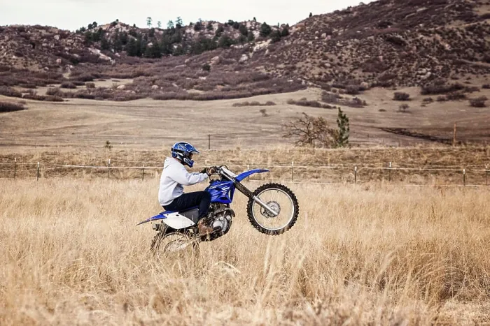 Framed Print : Young Man Dirt Biking in the Foothills in Colorado Framed Print : Young Man Dirt Biking in the Foothills in Colorado