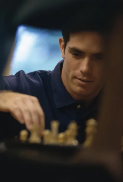 Framed Print : Young man playing chess Framed Print : Young man playing chess