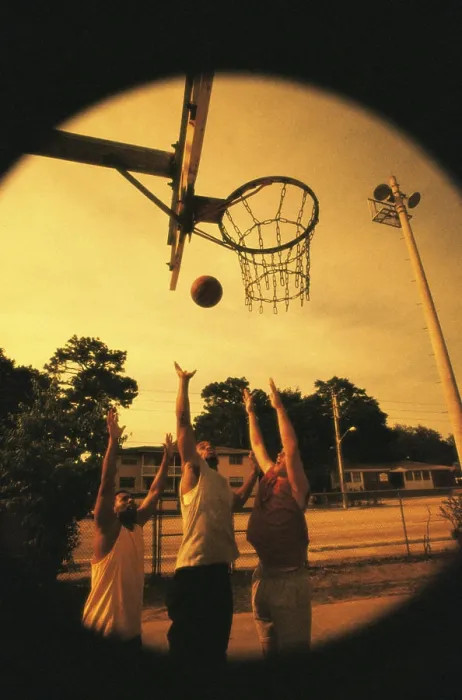 Framed Print : Three young men playing basketball