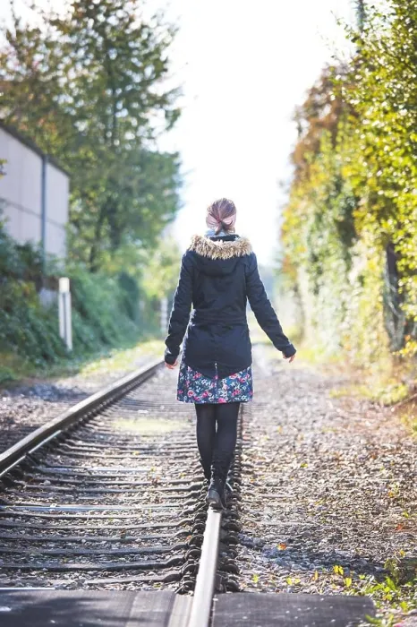 Framed Print : Young pretty girl is balancing on railroad, concept for travelling Framed Print : Young pretty girl is balancing on railroad, concept for travelling