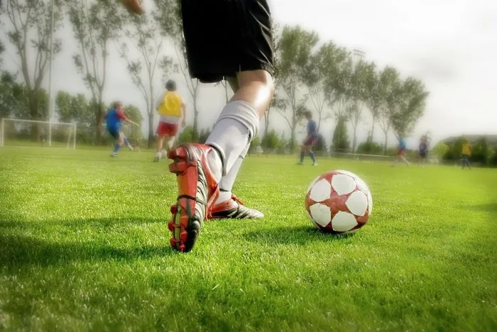 Framed Print : Young Soccer Player About To Kick Ball