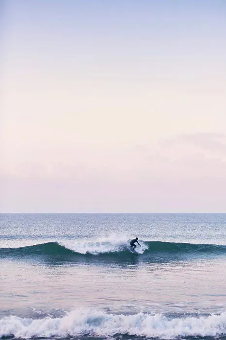 Framed Print : A young surfer off the coast of Portugal on an early January morning Framed Print : A young surfer off the coast of Portugal on an early January morning