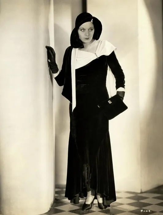 Framed Print : Young woman in elegant dress posing in corridor, 1931