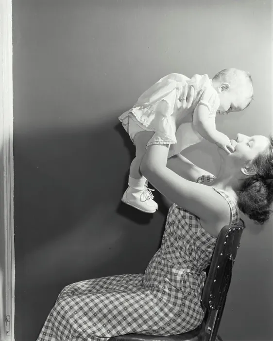 Framed Print : Young woman playing with her daughter