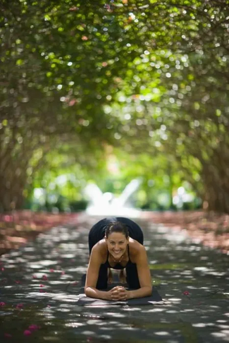 Framed Print : Young woman practicing yoga in park Framed Print : Young woman practicing yoga in park