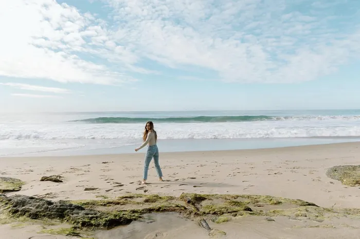Framed Print : Young woman walking on California beach