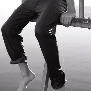 Boy Seated on Dock with Wet Clothes