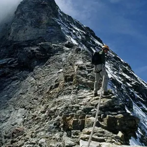 Climber descending hornli ridge on matterhorn Climber descending hornli ridge on matterhorn