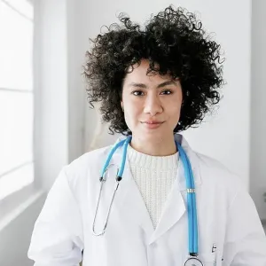 Doctor with curly hair at medical clinic Doctor with curly hair at medical clinic