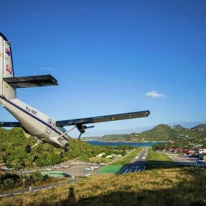 French West Indies, St-Barthelemy, Gustavia, aircraft landing at St-Barthelemy Airport (SBH) French West Indies, St-Barthelemy, Gustavia, aircraft landing at St-Barthelemy Airport (SBH)