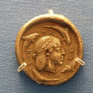 Greek Decadrachm (ten-drachma coin) of Syracuse showing a head of the nymph Arethusa surrounded by dolphins
