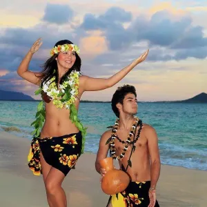Hawaii, Oahu, Hula Dancer Couple Along Beach Shoreline At Sunrise Hawaii, Oahu, Hula Dancer Couple Along Beach Shoreline At Sunrise