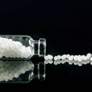 Homeopathic globules scattered out of glass bottle Homeopathic globules scattered out of glass bottle